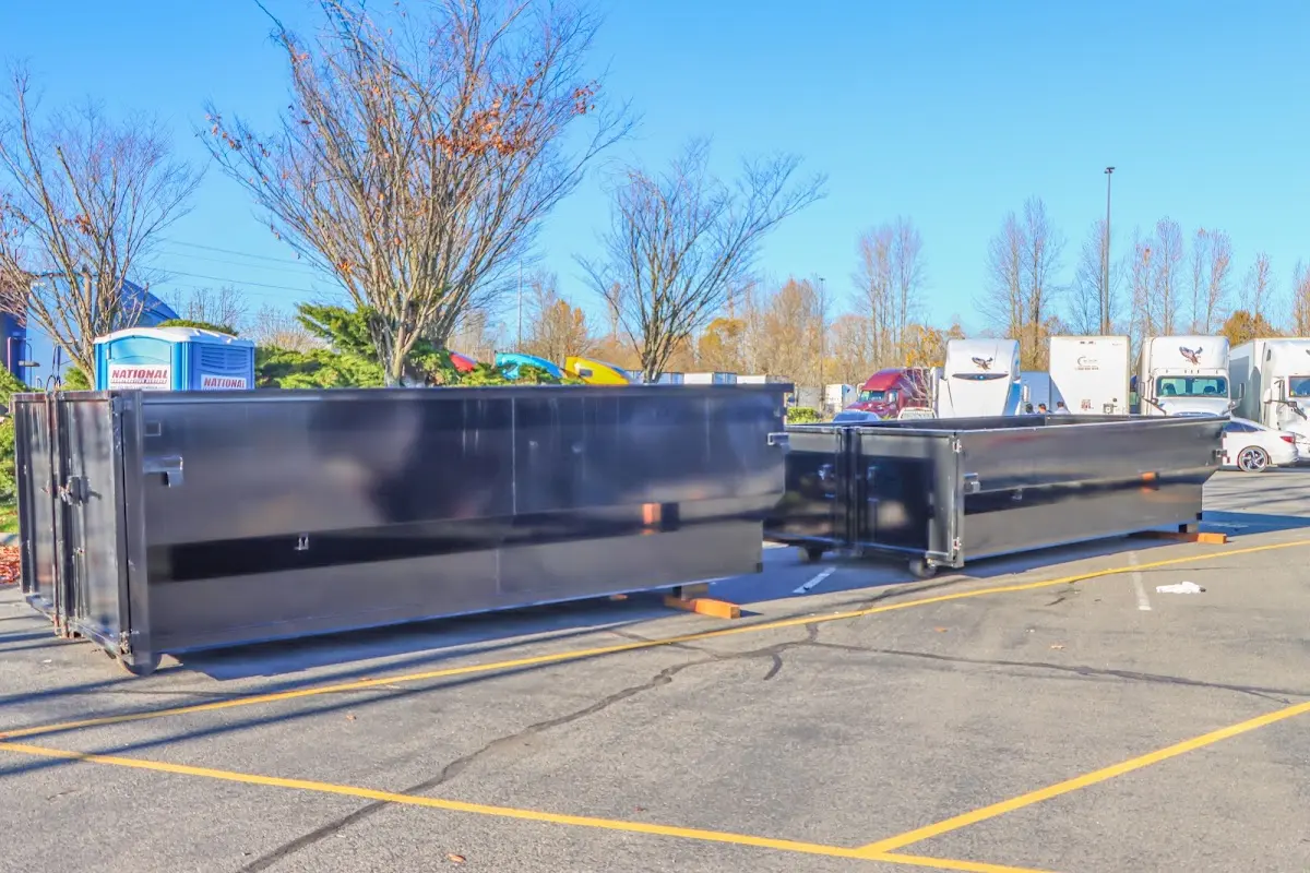 Professional dumpster rental service with roll-off container on residential driveway in Cotati